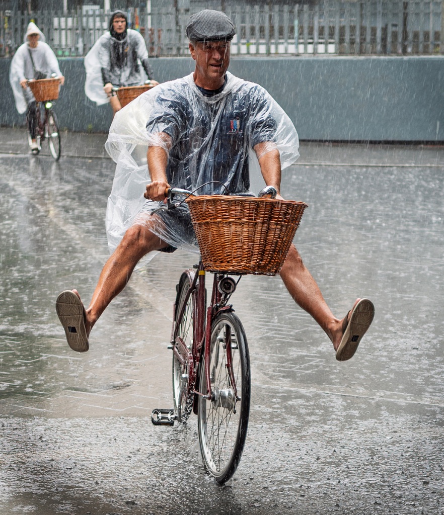 CYCLING IN THE RAIN by Jeff Haynes