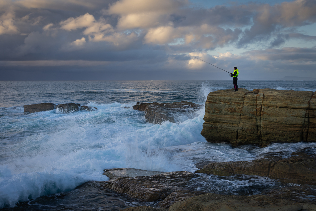 FISHERMAN ON THE ROCKS by Fiona Rich